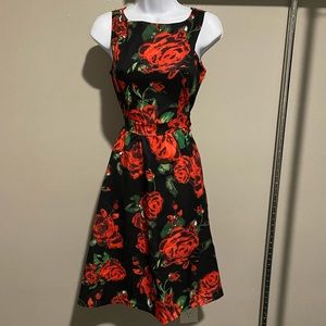 Rose covered dress, knees length.